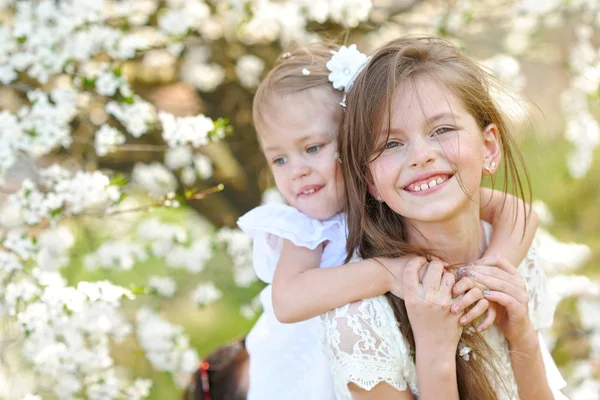 Portrait of two little girls girlfriends spring — Stock Photo, Image