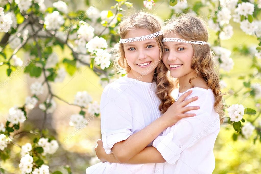 Portrait of two little girls twins