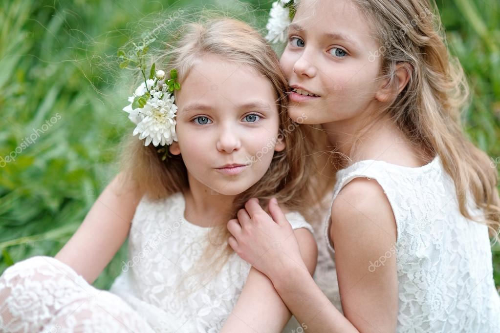 Portrait of two little girls twins