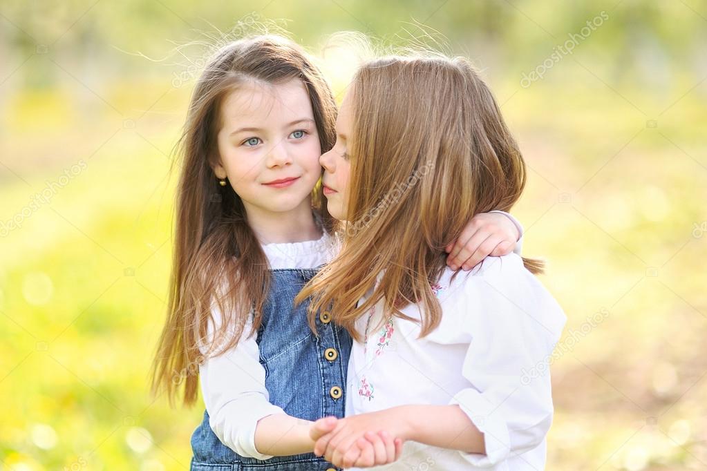 Portrait of two girls in the woods girlfriends