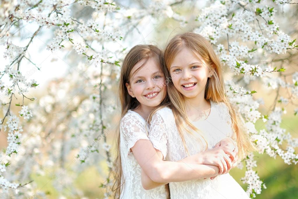 Portrait of two little girls girlfriends spring