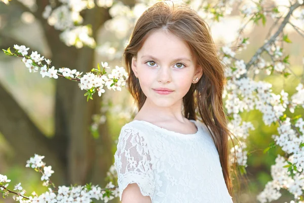 Portrait of a beautiful little girl in spring — Stock Photo, Image
