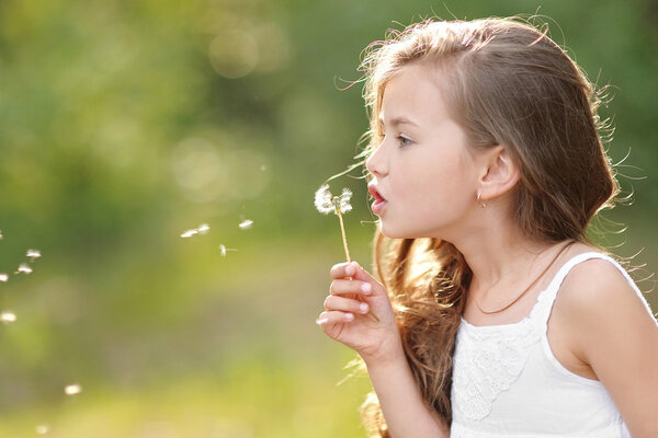 portrait of a beautiful little girl with flowers