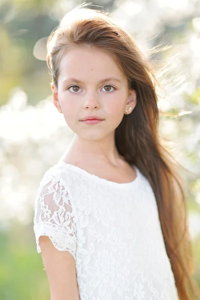 Portrait of a beautiful little girl in spring — Stock Photo, Image