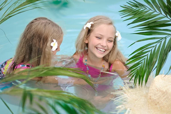 Portrait Of Two Girls In A Swimming Pool Stock Photo By ©zagorodnaya