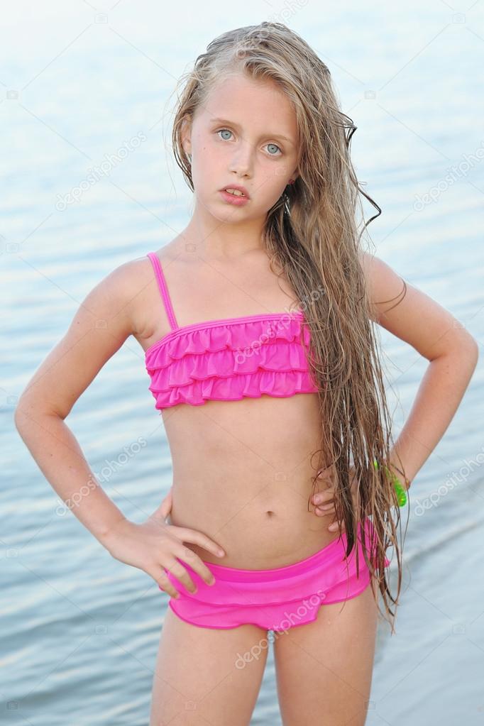 portrait of little girl outdoors in summer