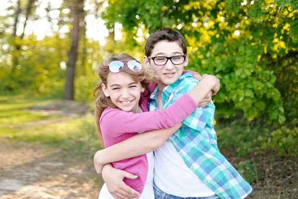 Portrait of a boy and girl  in summer — Stock Photo, Image