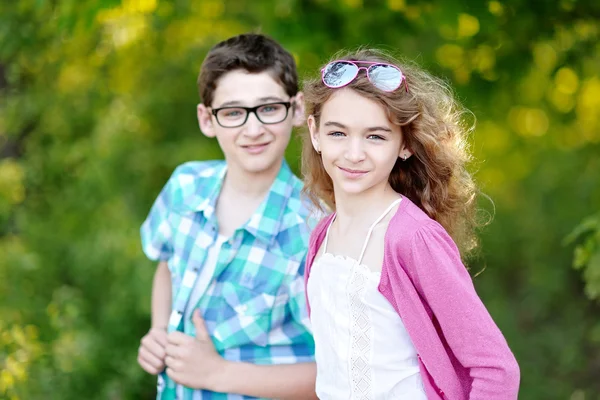 Portrait of a boy and girl  in summer — Stock Photo, Image