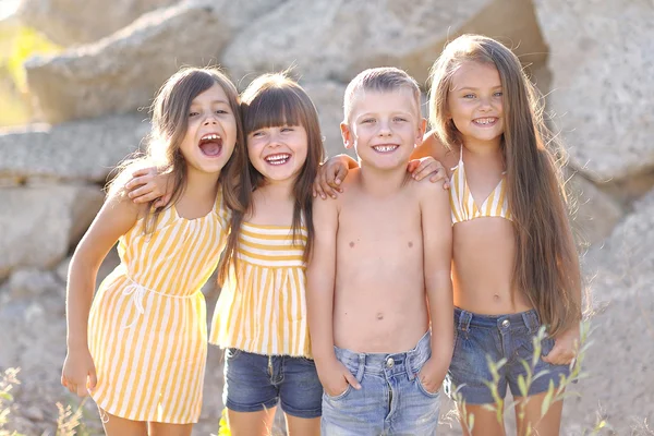 Portrait of happy children on nature in summer — Stock Photo, Image