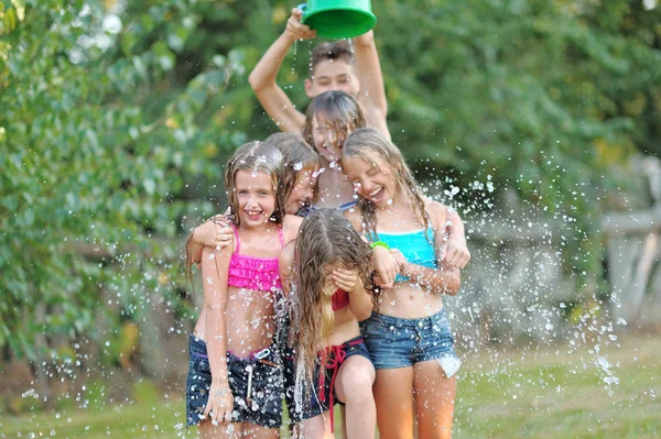 Portrait of happy children on nature in summer — Stock Photo, Image