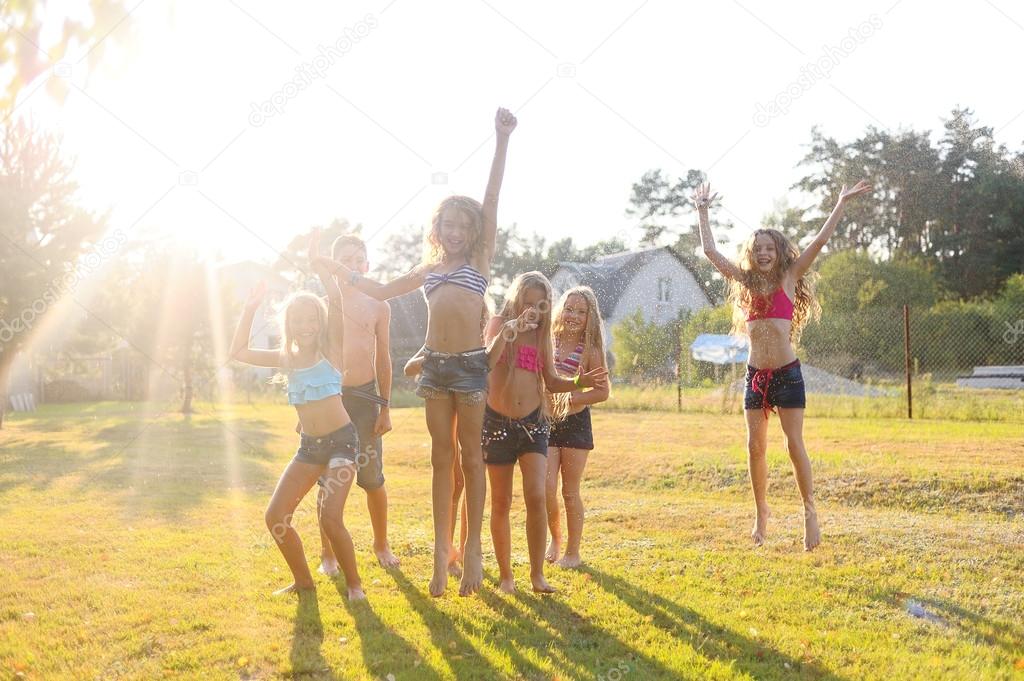 Portrait of happy children on nature in summer