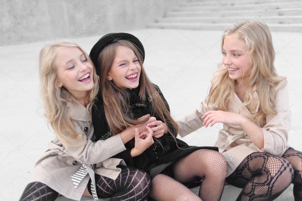 Portrait of three girlfriends on the nature