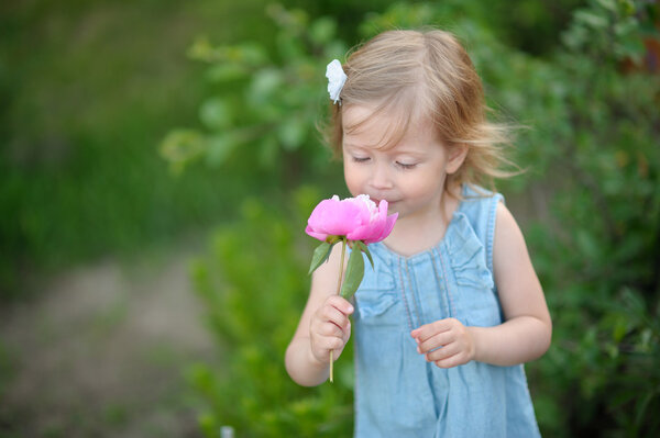 portrait of little girl outdoors in summer