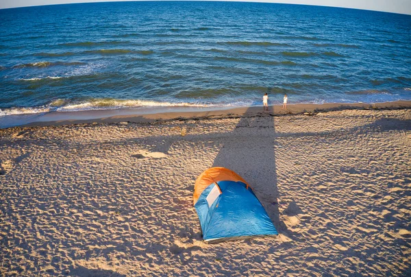 Bright tent by the sea in the evening light — Stock Photo, Image