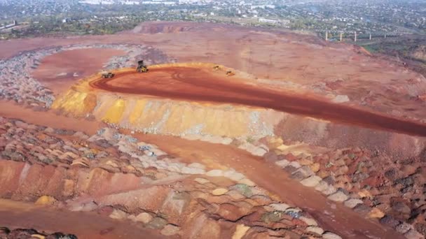 Huge mounds of waste iron ore near the quarry — Stock Video