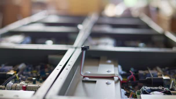 Slider shot of a metal components and microcircuits in workshop laboratory — Stock Video