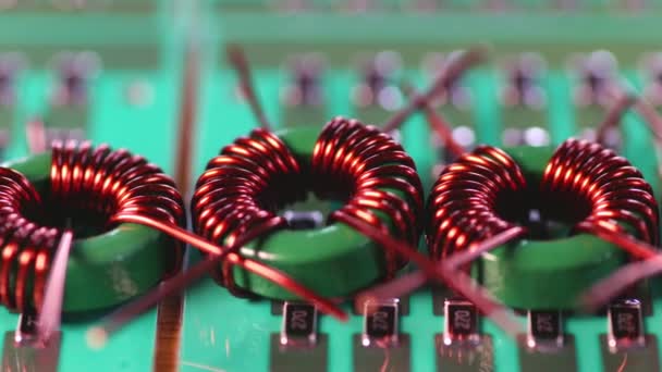 Slider shot of a many twisted copper coils lie — Stock Video