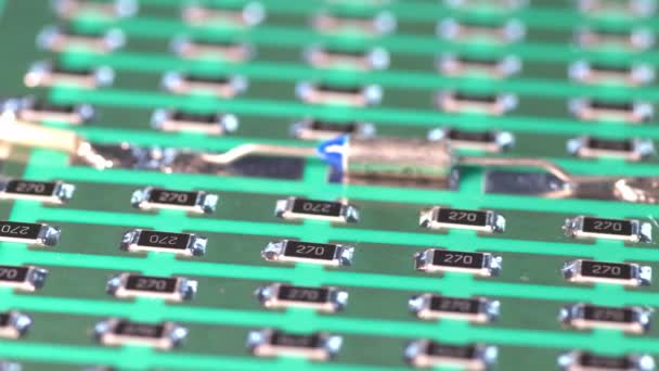 Slider pan shot of a a panel of SMD resistors — Stockvideo