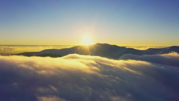 Wonderful view of extraordinary cloudy valley and bright orange sunset — Stock Video