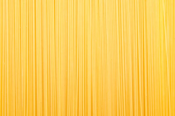 Hintergrund der ungekochten Spaghetti — Stockfoto