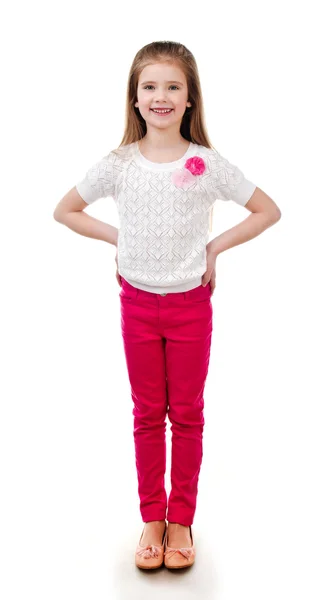 Adorable smiling little girl in pink jeans — Stock Photo, Image