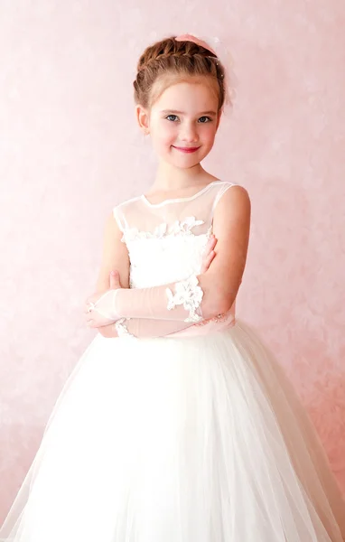 Adorable smiling little girl in white princess dress — Stock Photo, Image