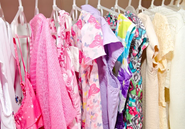 Colorful wardrobe of children clothes — Stock Photo, Image