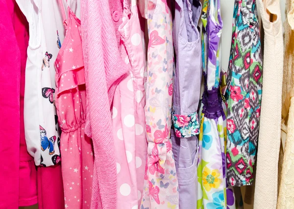Colorful wardrobe of children clothes — Stock Photo, Image