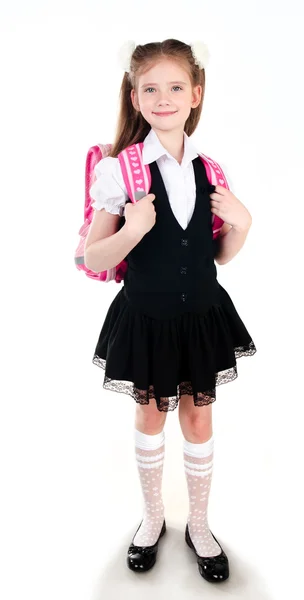 Aranyos iskoláslány egyenruhában-val a backpack mosolyogva — Stock Fotó