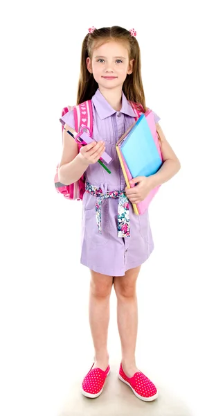 Портрет улыбающейся школьницы с книгами и рюкзаком изолирован — стоковое фото