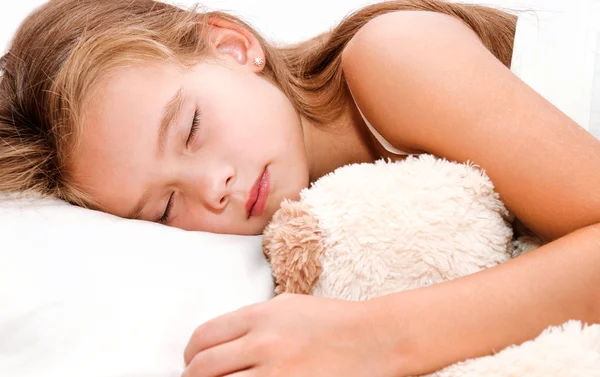 Adorabile bambina che dorme con giocattolo — Foto Stock