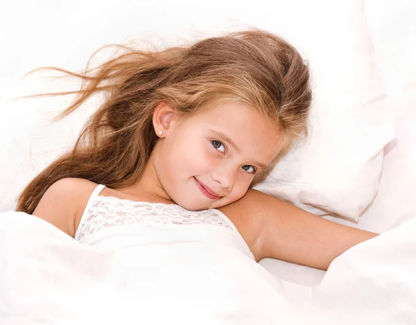 Adorable smiling little girl waked up — Stock Photo, Image