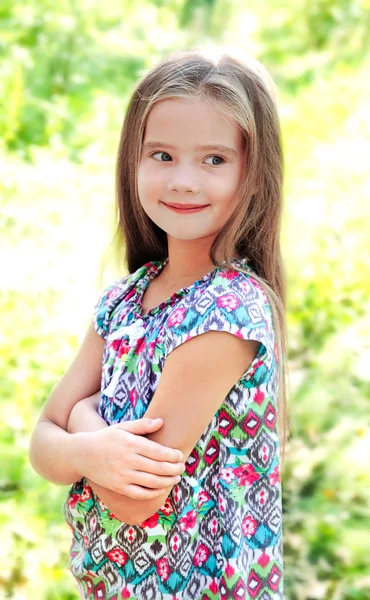 Portrait of adorable smiling little girl in summer day — Stock Photo, Image