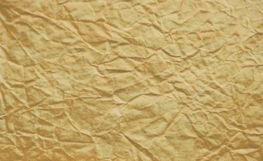 Kırışmış altın sarısı eski kağıt soyut duvar arkaplanı. Metin için alanı olan doku pankartı