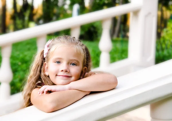 Portrait of adorable little girl in the park — Stock Photo, Image