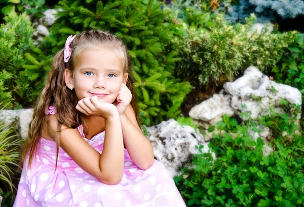 Portrait of adorable little girl in the park — Stock Photo, Image