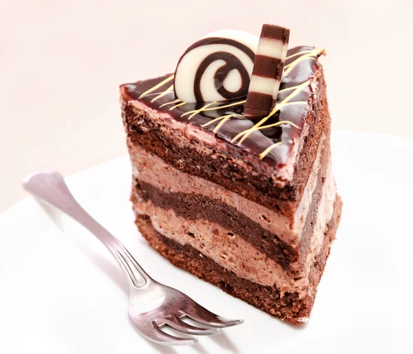 Piece of chocolate cake and fork — Stock Photo, Image