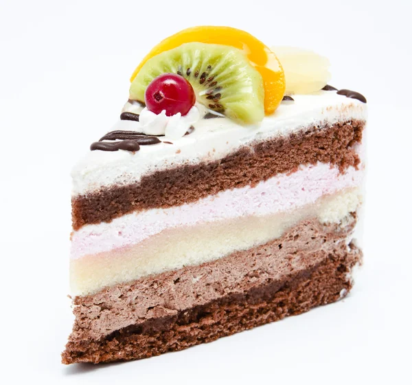 Piece of chocolate cake with icing and fresh fruit — Stock Photo, Image