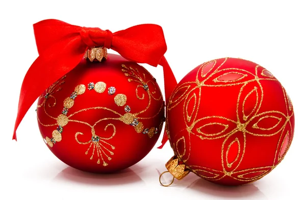 Two red christmas balls with ribbon isolated on a white — Stock Photo, Image
