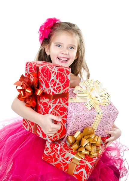 Happy adorable little girl with christmas gift boxes — Stock Photo, Image