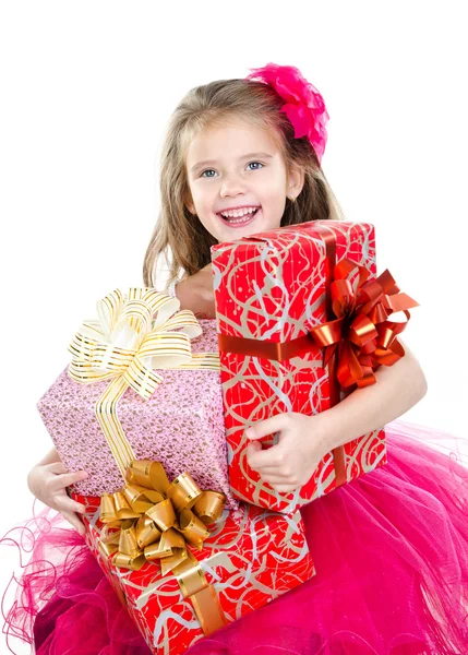 Happy adorable little girl with christmas gift boxes — Stock Photo, Image