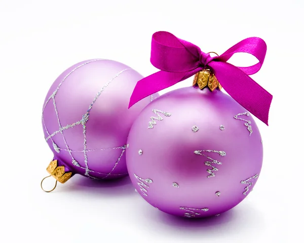 Two lilac christmas balls with ribbon isolated — Stock Photo, Image