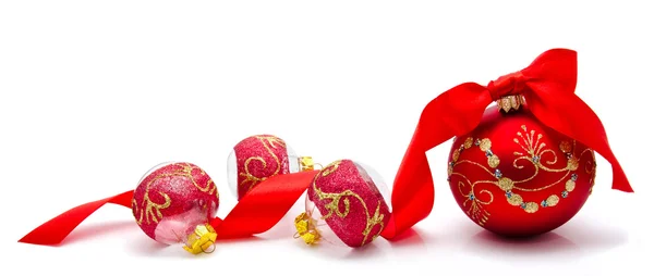 Red christmas balls with ribbon isolated on a white — Stock Photo, Image