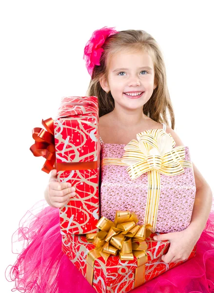 Happy adorable little girl with christmas gift boxes — Stock Photo, Image