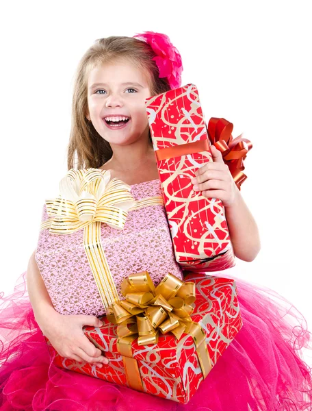 Menina adorável feliz com caixas de presente de Natal — Fotografia de Stock