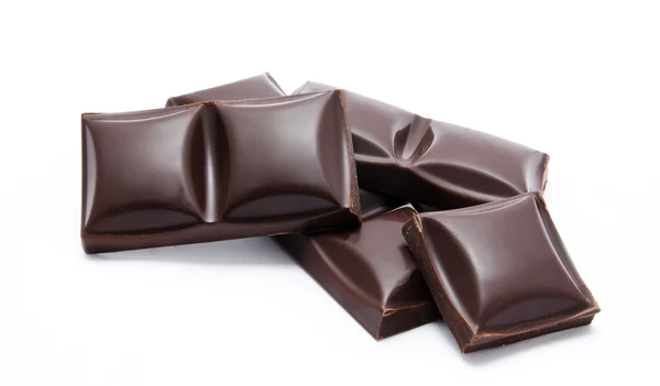 Dark chocolate bars stack with crumbs isolated — Stock Photo, Image
