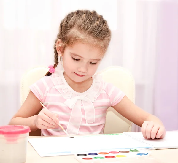 Cute little girl drawing with paint and paintbrush — Stock Photo, Image