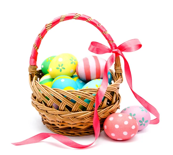 Colorful handmade easter eggs in the basket isolated — Stock Photo, Image