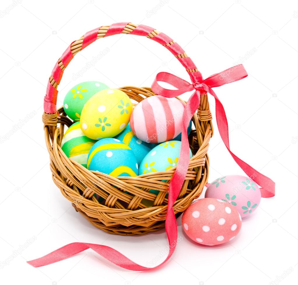 Colorful handmade easter eggs in the basket isolated 
