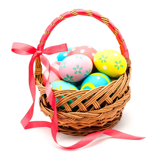 Colorful handmade easter eggs in the basket isolated — Stock Photo, Image